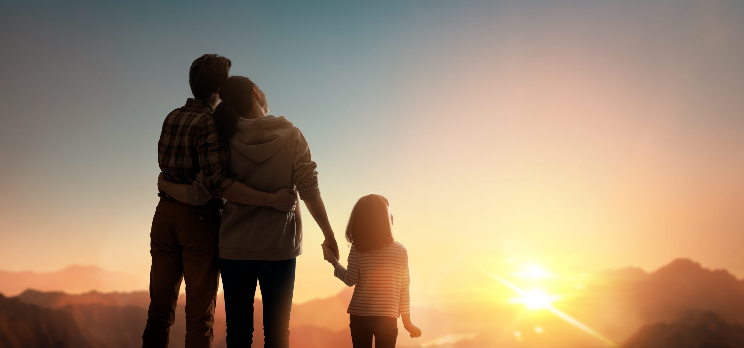 Happy family at sunset. Father, mother and child are having fun and enjoying journey.