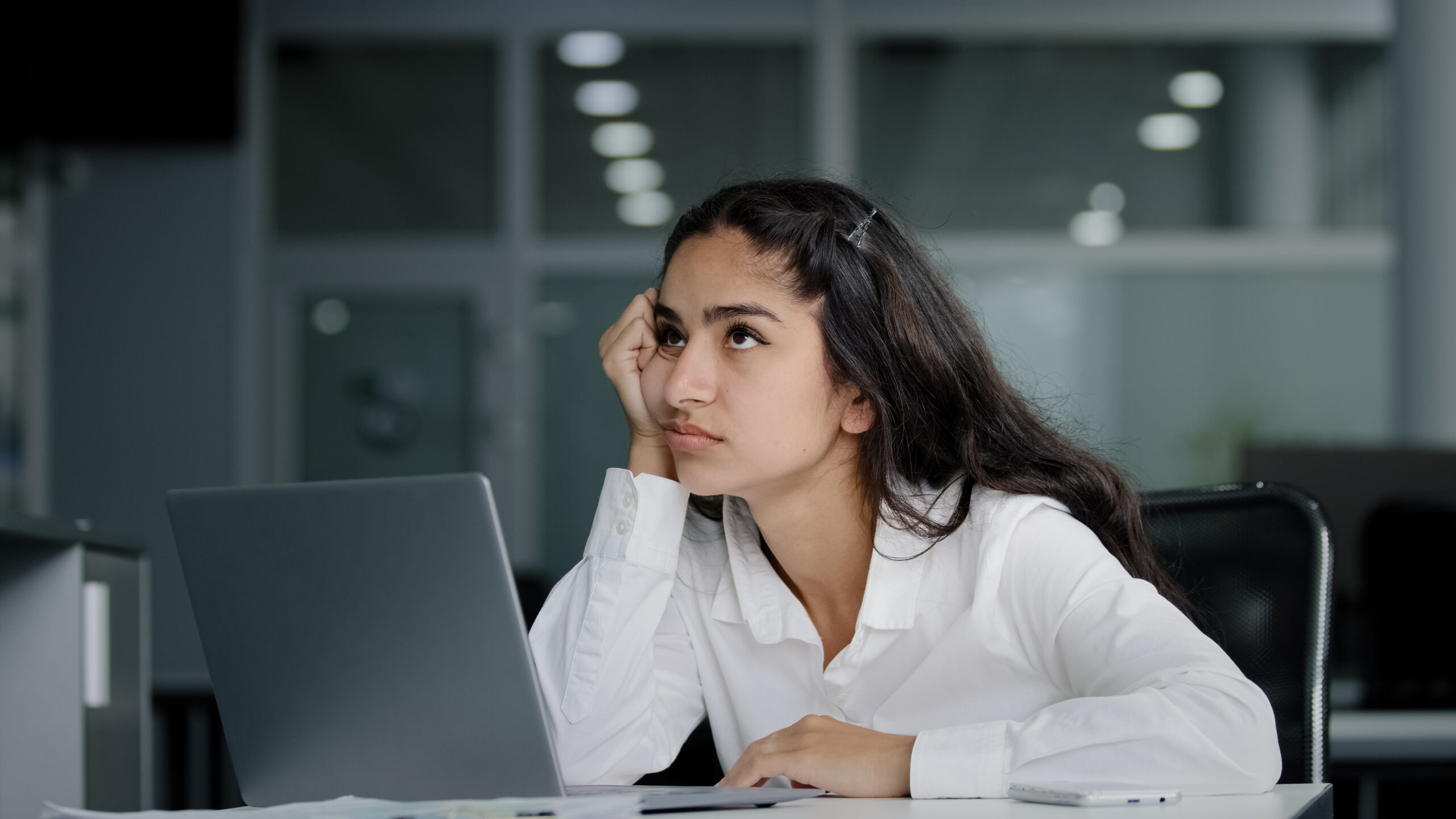 Sad bored lazy young woman typing on laptop tired unmotivated businesswoman office worker feels fatigue from working at computer suffers from overwork distracted from boring dull job feeling exhausted. High quality 4k footage