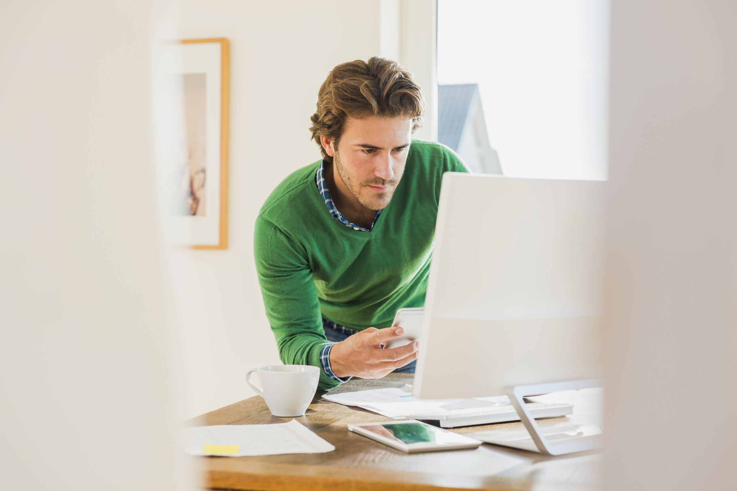 Young man working at home office