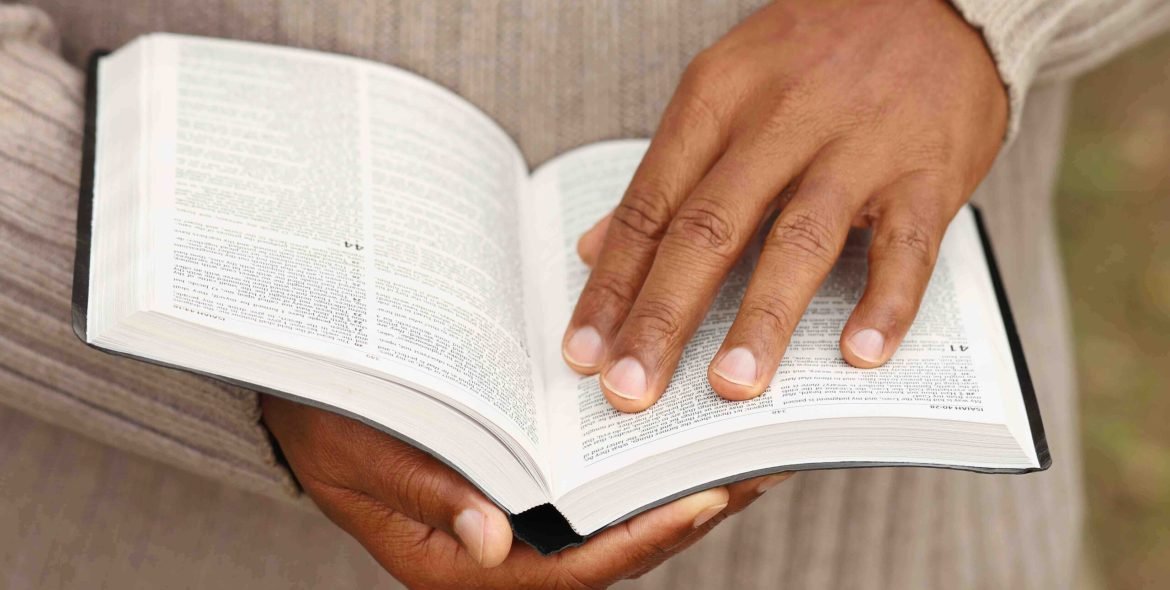 Man holding a Bible