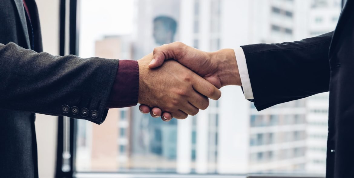 Business people shaking hands. Businessman shaking hands during a meeting in the office