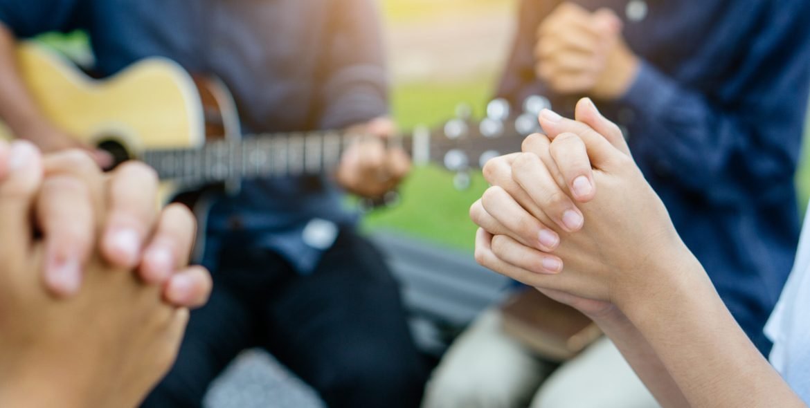 Group of people praying and worship god.