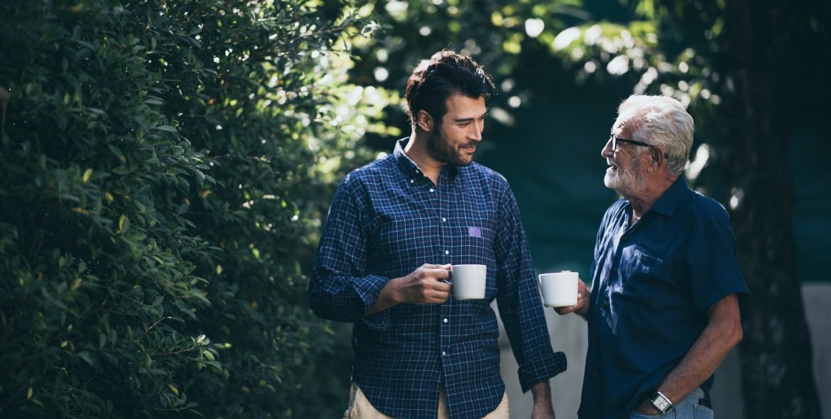 Happy Father and son with coffee cup