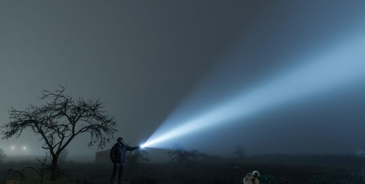 man-and-dog-searching-at-night-2021-08-29-17-10-36-utc