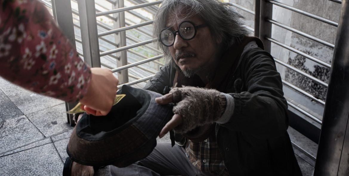 Homeless people living in various cities He waited and needed help from the kind people to give him all the necessary things, clothing, bread, water, and home. He is dirty and has no money with him.