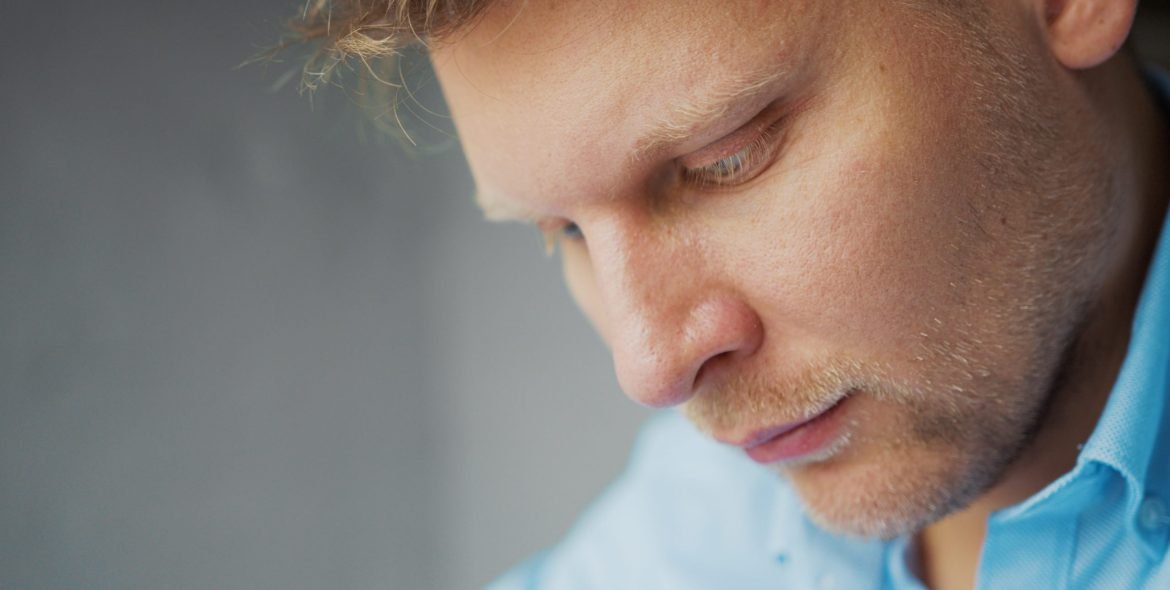 Thinking man at work, close-up