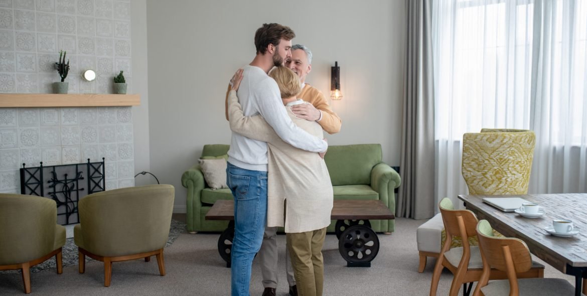 Happy family. Young man visiting his parents and family looking happy