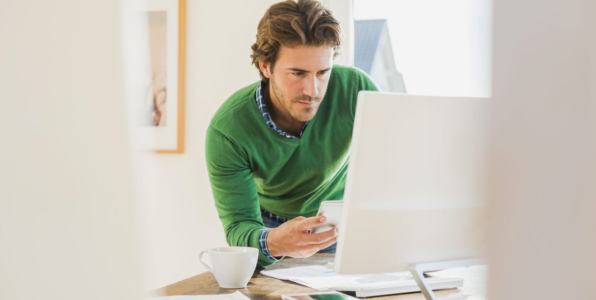 Young man working at home office